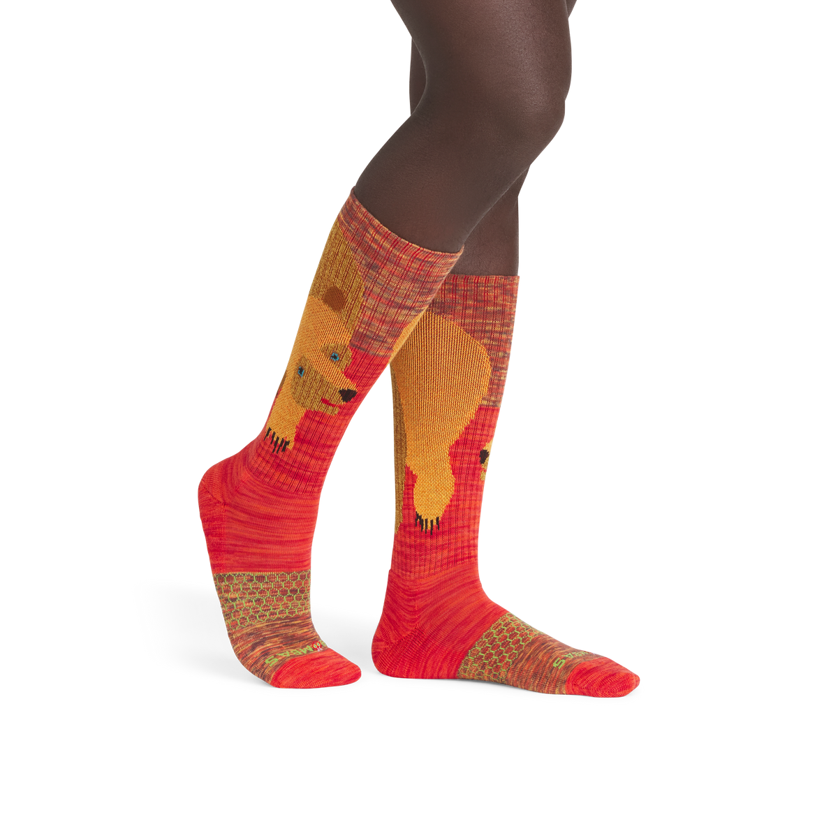official-bombas::5293-bitterorange-darkchocolate-goldenbeet-redmangrove-adult-male-onmodel-2-transparent.png